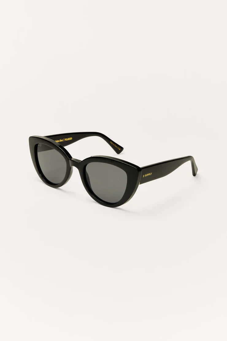 Polished black cat-eye sunglasses with dark grey gradient lenses