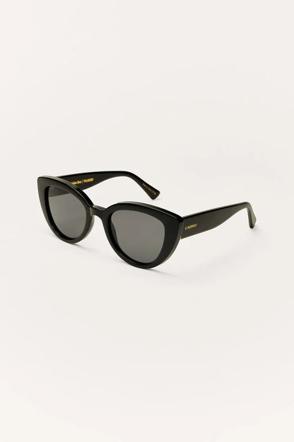 Polished black cat-eye sunglasses with dark grey gradient lenses