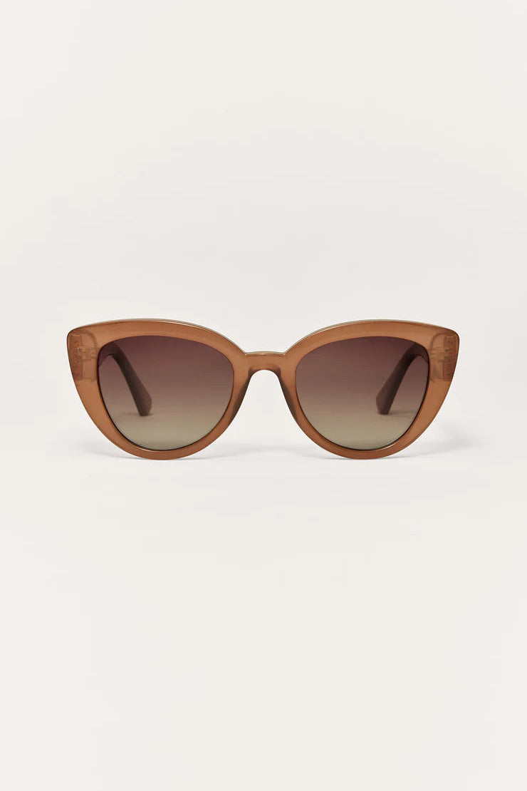 Taupe cat-eye sunglasses with dark gradient lenses and slim arms