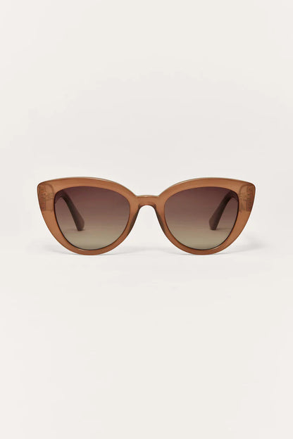 Taupe cat-eye sunglasses with dark gradient lenses and slim arms