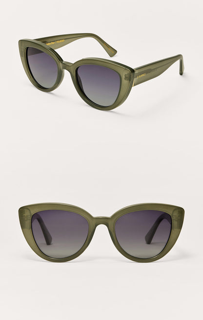 Olive cat-eye sunglasses with purple-toned gradient lenses