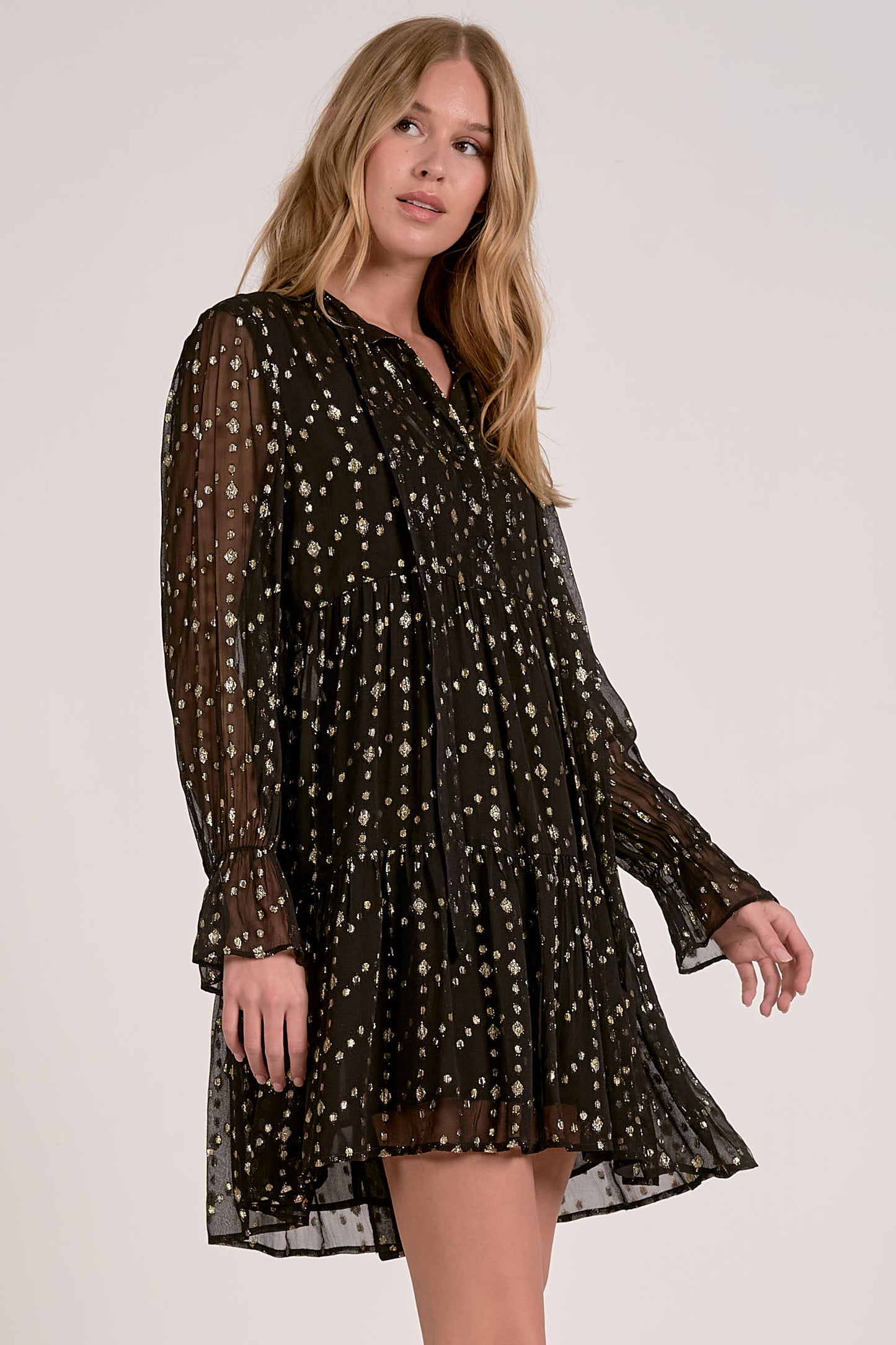 V-NECK BOTTOM RUFFLE DRESS IN BLACK GEO PRINT SIDE VIEW