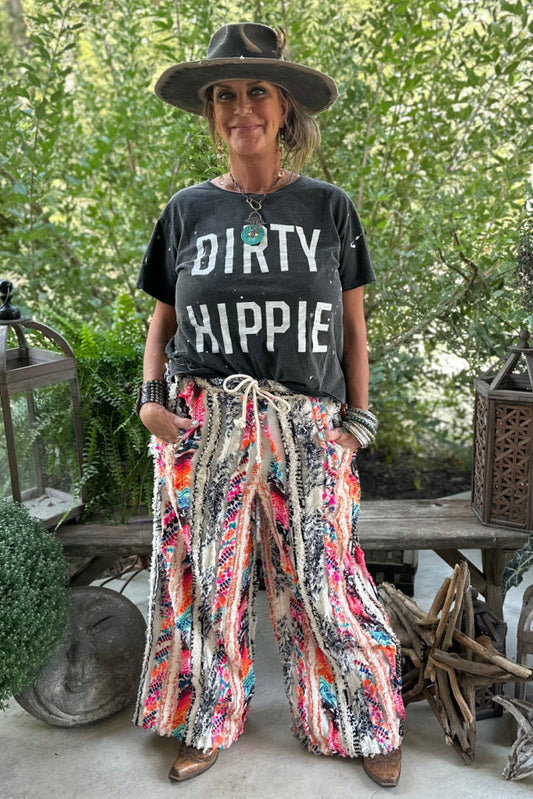 Black Dirty Hippie T-shirt with large white distressed text, worn by model