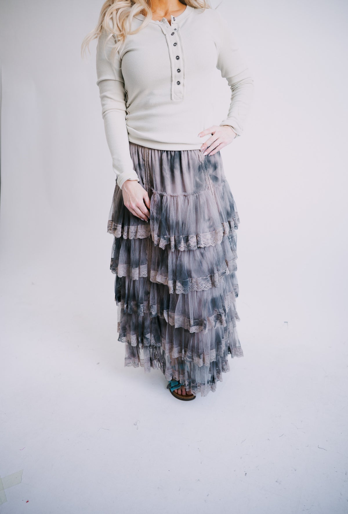 Tiered ruffle skirt with dark charcoal and blue layers, elastic waistband