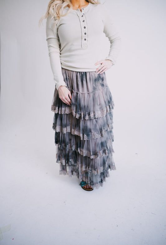 Tiered ruffle skirt with dark charcoal and blue layers, elastic waistband
