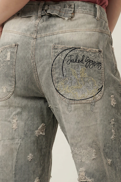 Back pocket of peace & love jeans in midnight railroad with a pocket featuring the Jaded Gypsy logo