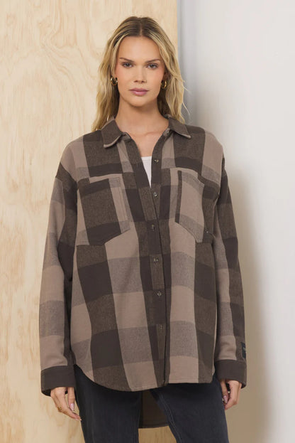 Oversized plaid flannel button-down shirt, brown-and-tan plaid pattern, front button closure.