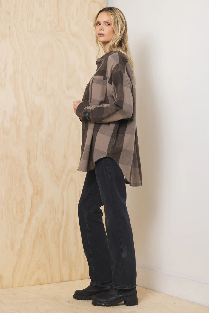 Oversized plaid flannel button-down shirt in brown and tan, long sleeves, button front.