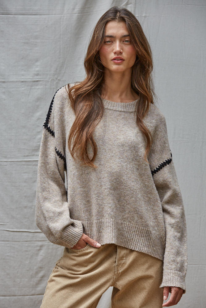 Mocha knit sweater with contrast whipstitch on sleeves and crew neck
