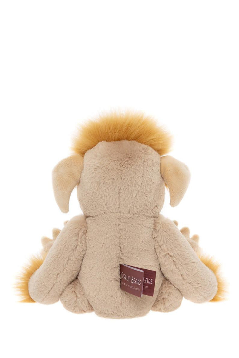 Back view of a plush bedrock toy with a visible tag on a white background