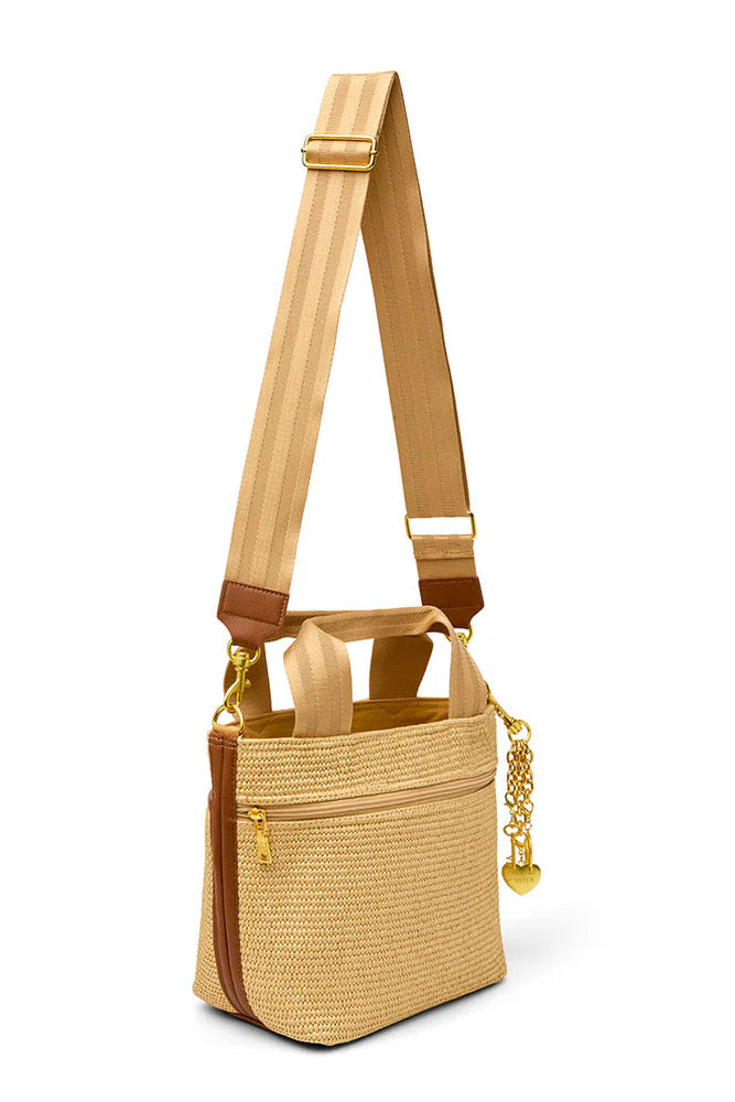 Tan raffia crossbody tote with long strap, chain detail, and front zip pocket