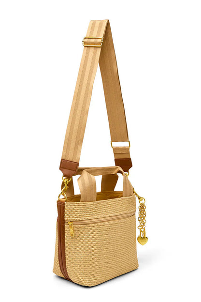 Tan raffia crossbody tote with long strap, chain detail, and front zip pocket