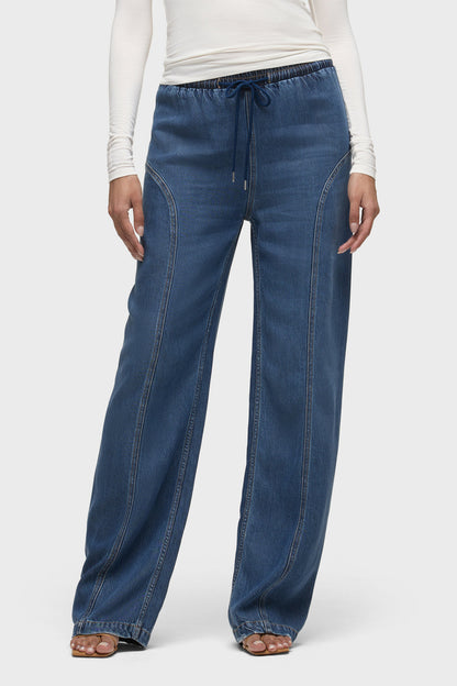 Blue denim drawstring pants with elastic waist and relaxed straight legs