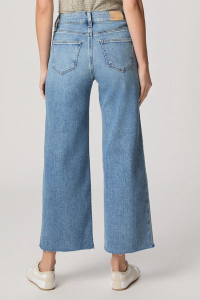 Light blue wide-leg jeans with back welt pockets and raw hem