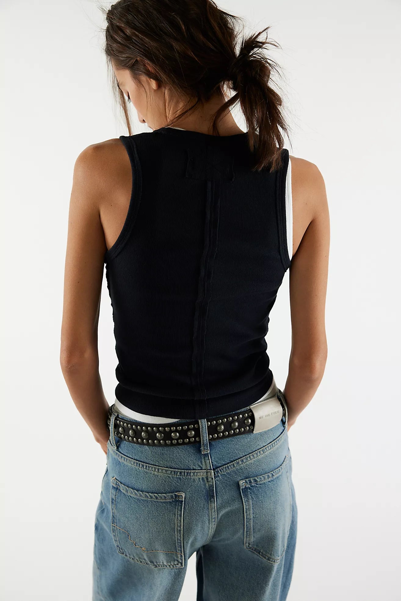 Black sleeveless V-neck tank top with back seam detail and fitted cut