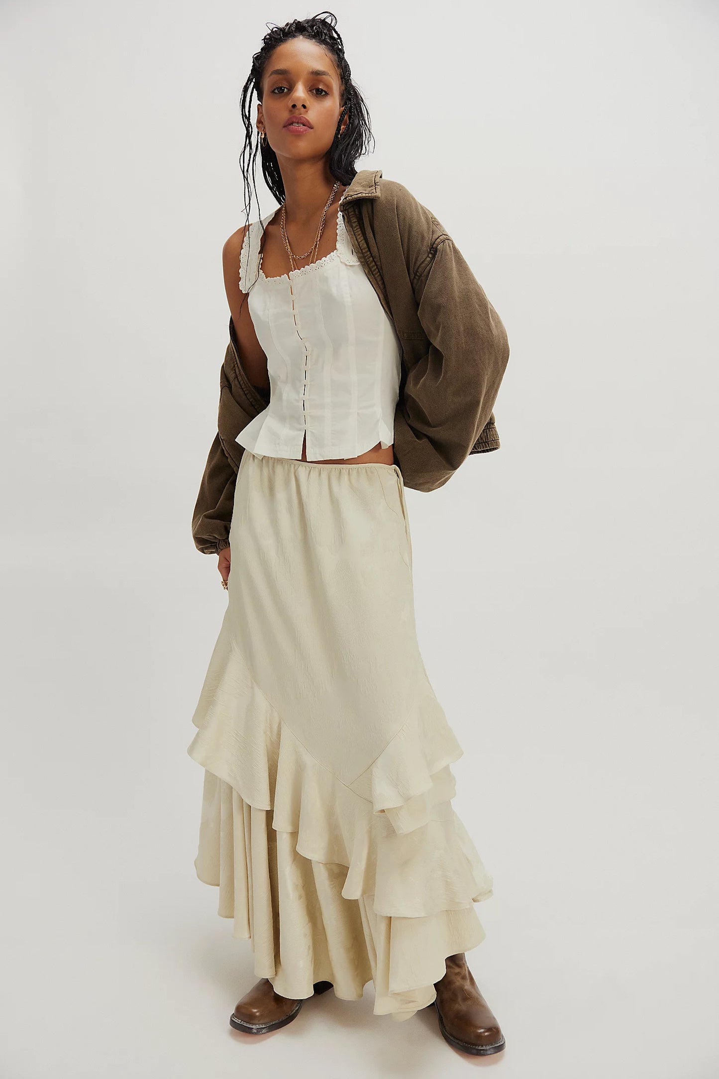 Ivory corset top with lace-trim square neckline, button front, and thin straps