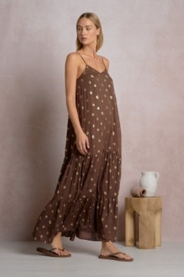 Brown polka-dot tiered maxi dress on thin straps with flowing tiered skirt