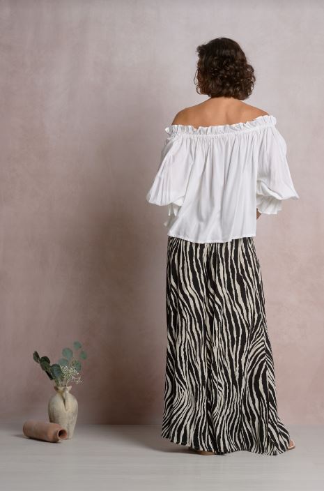White off-shoulder long-sleeve top with gathered elastic neckline, back view