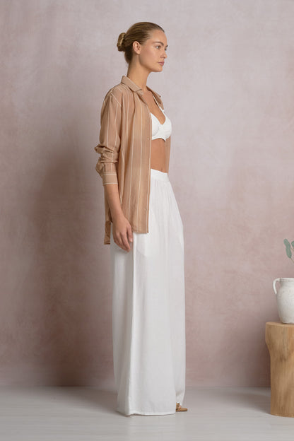 BUTTON DOWN GRAPHIC TOP IN TAN SIDE VIEW