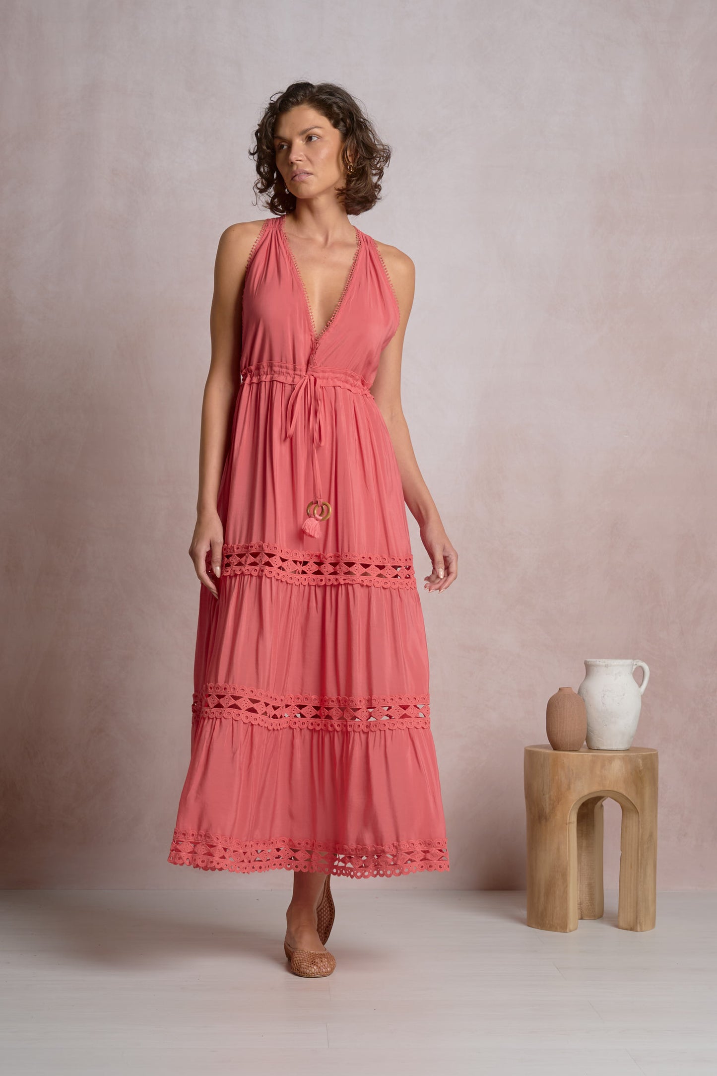 Maxi halter dress in bright pink with tiered skirt and lace-trimmed ruffles