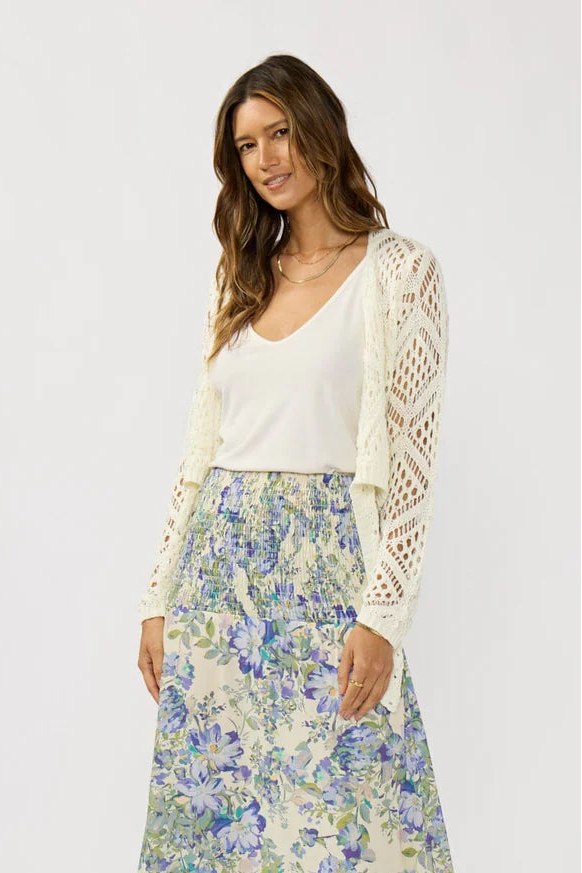 Vanilla open crochet tie-front top over white scoop-neck cami