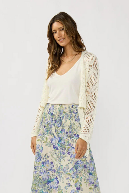 Vanilla open crochet tie-front top over white scoop-neck cami