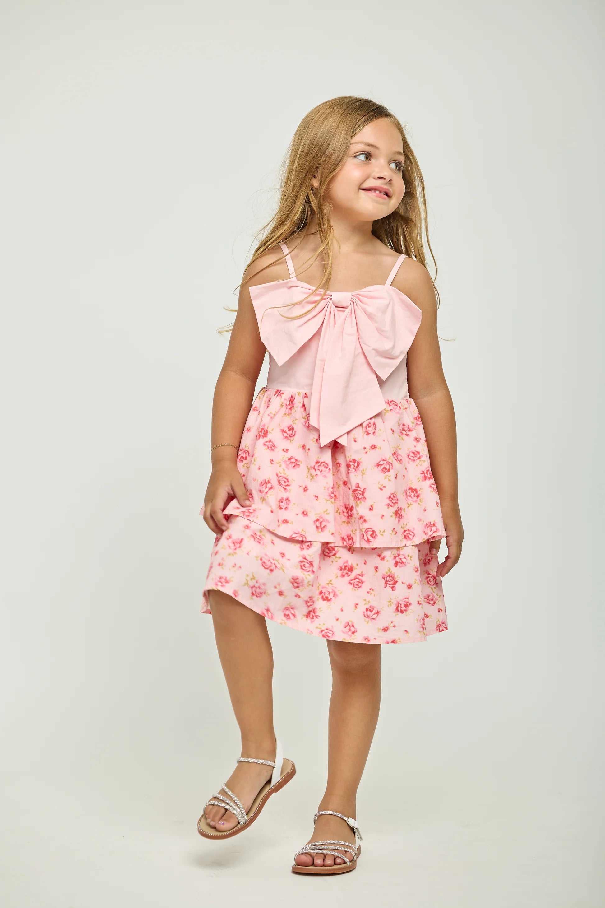 Petal bow ruffle dress in pink front view