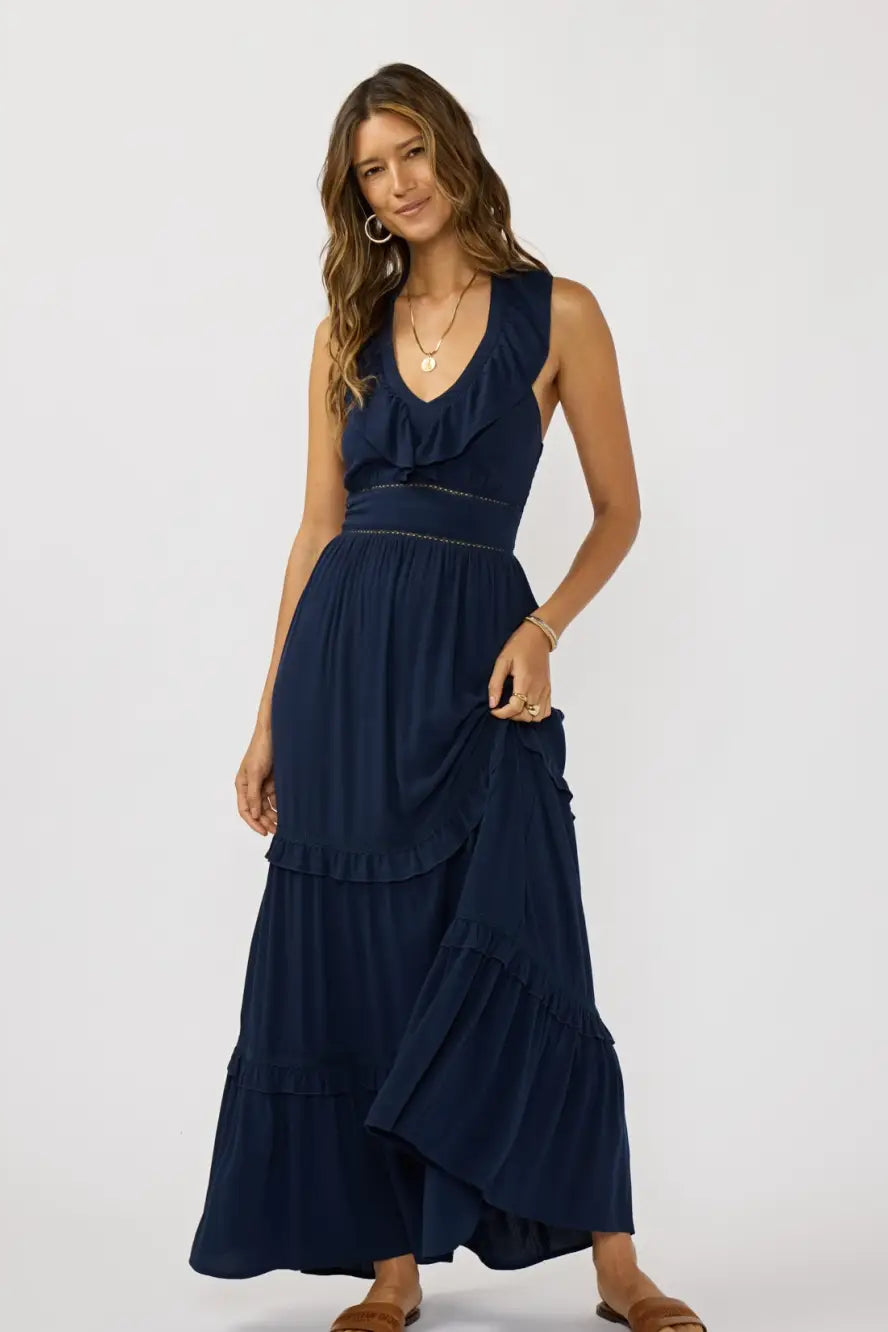 Navy v-neck tiered maxi dress with lace-trimmed ruffles and sleeveless cut