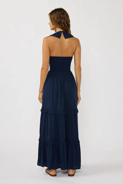 Navy v-neck tiered maxi dress with lace-trimmed tiers and open-back V strap