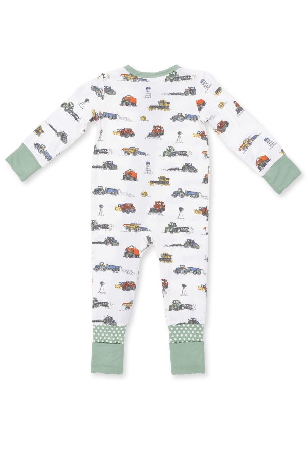 A baby long-sleeve footless one-piece pajama with an all-over farm machines print on a white background, featuring sage green cuffs and hem.