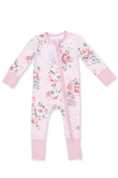 A baby long-sleeve footless zip-up sleeper in light pink with a watercolor painterly rose bouquet floral print in red, blue, and green, featuring solid pink cuffs and leg warmers.