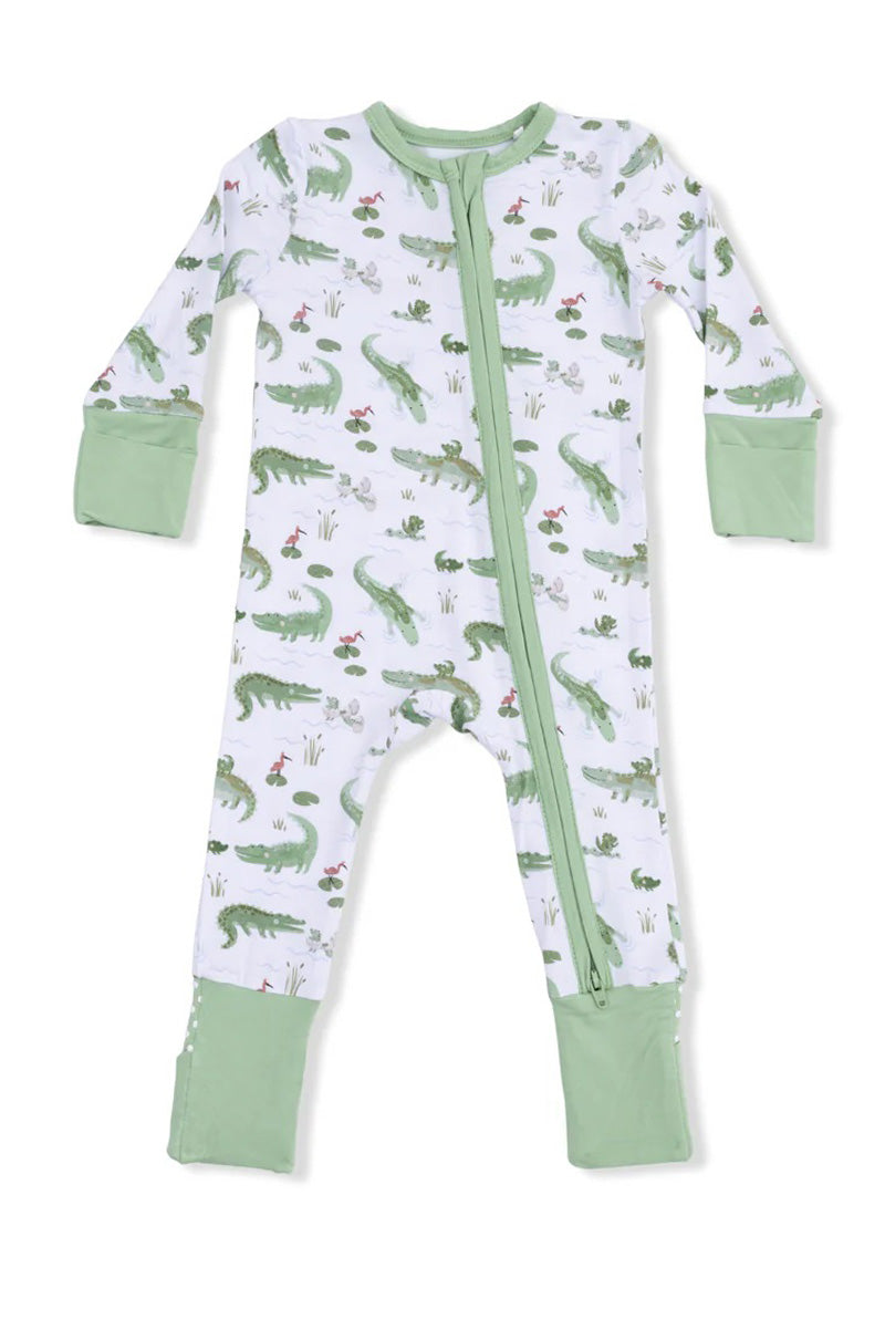 Convertible romper with long sleeves, crocodile print, front zipper, green cuff pockets.