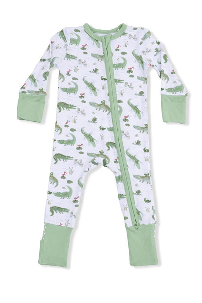 Convertible romper with long sleeves, crocodile print, front zipper, green cuff pockets.