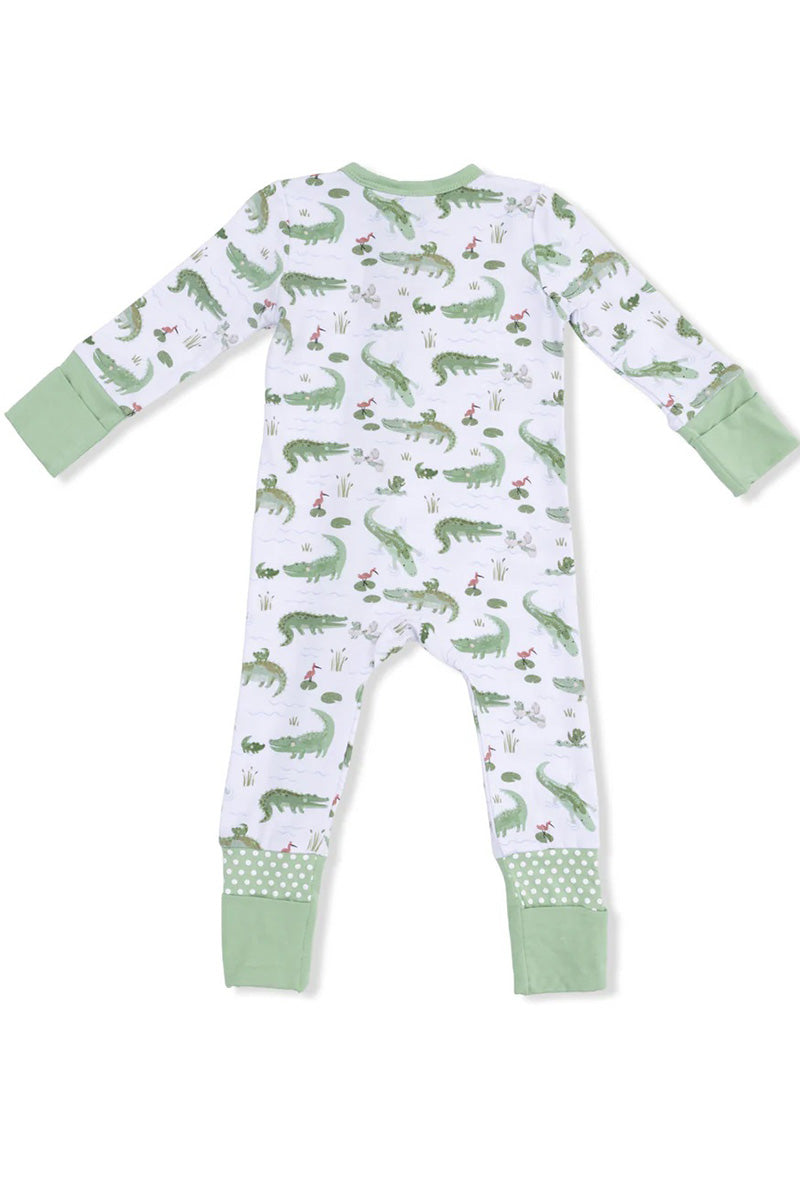 Convertible romper with long sleeves, dinosaur print, green cuff trim, footed legs.