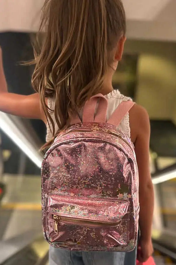 Pink glitter backpack with two shoulder straps and gold front zipper