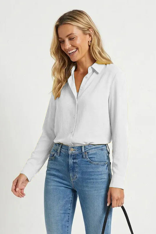 Long sleeve button up blouse in off white front view