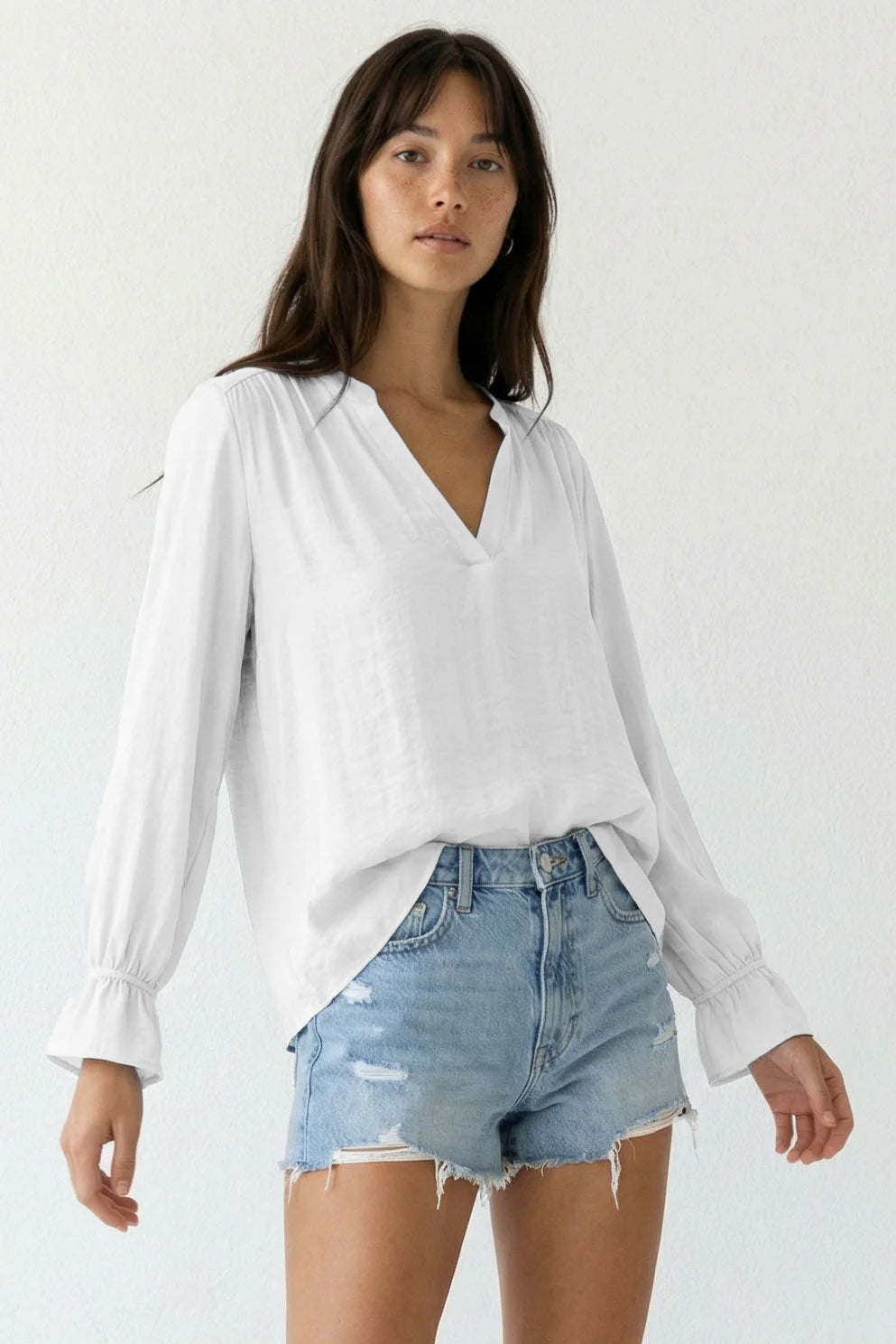 Vneck blouse with flared cuffs in off white front view