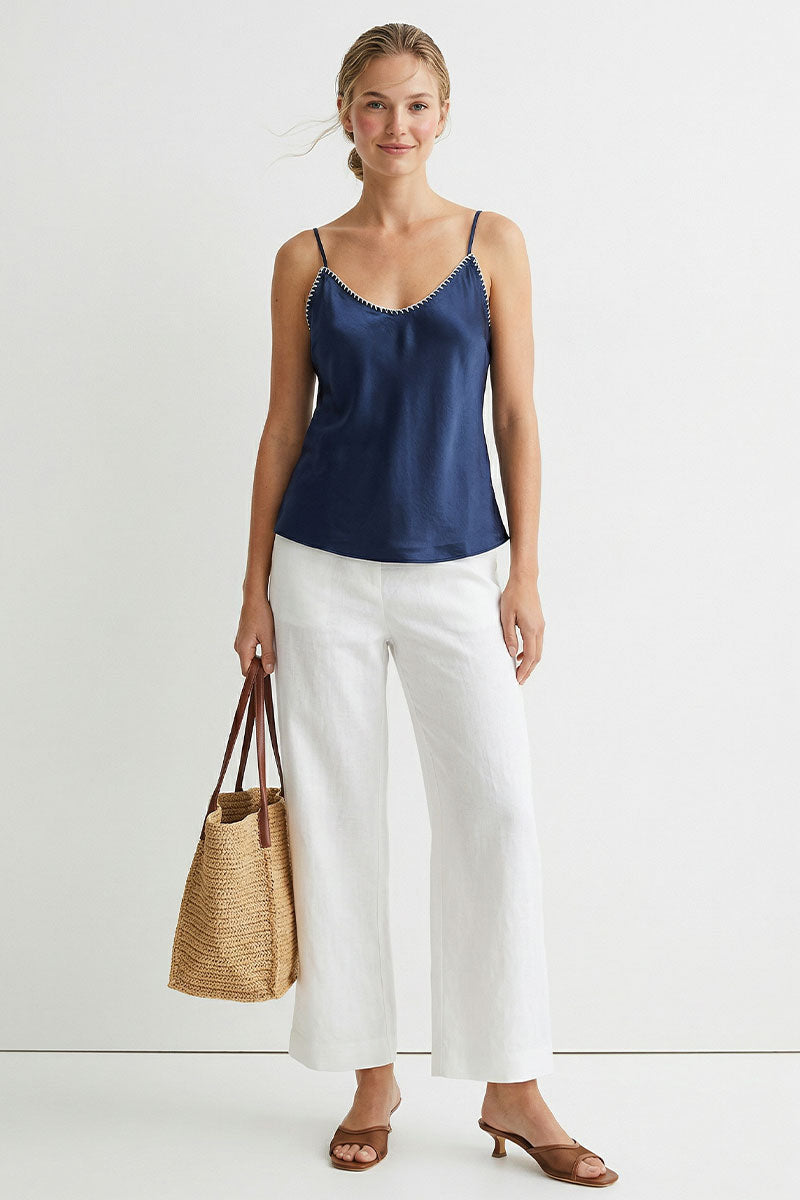 Navy satin camisole with spaghetti straps and scalloped whipstitch neckline