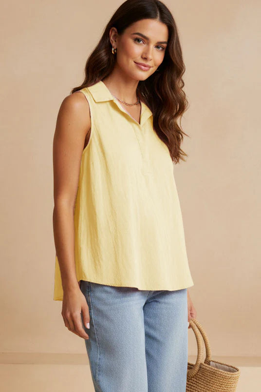 Sleeveless collared half placket top in pale banana front view
