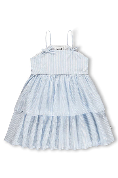 Light blue tiered Chelsea dress with spaghetti straps, gathered yoke, and bow ties