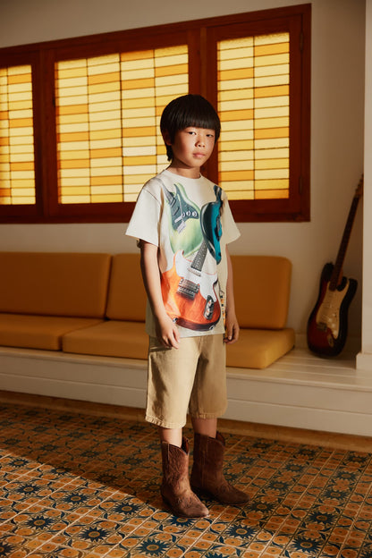 Tan cotton art-style shorts with front pockets and belt loops