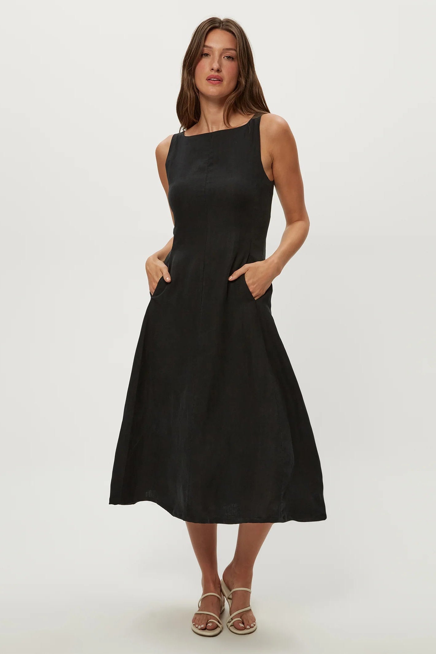 Black fit-and-flare midi dress with sleeveless square neckline and pleated skirt