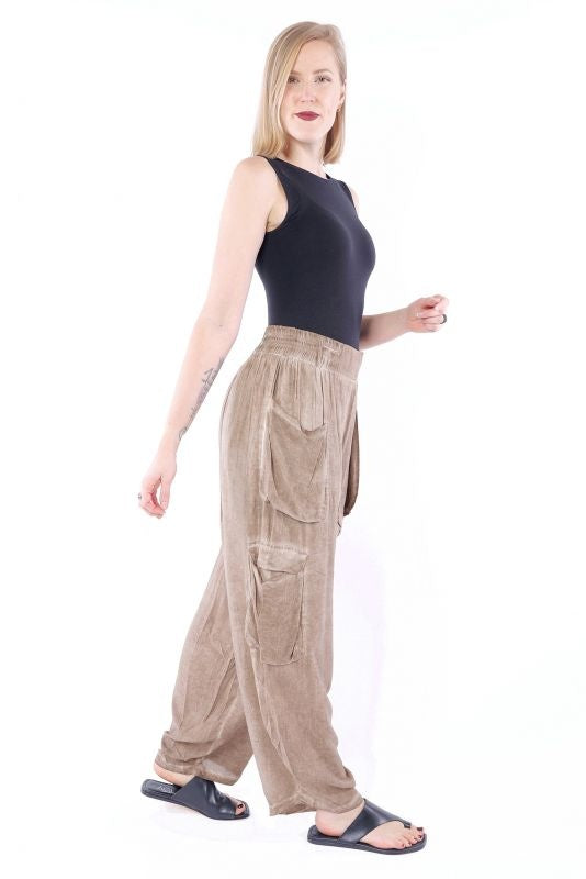 Brown cargo pants with flap cargo pockets and loose ankle-length legs