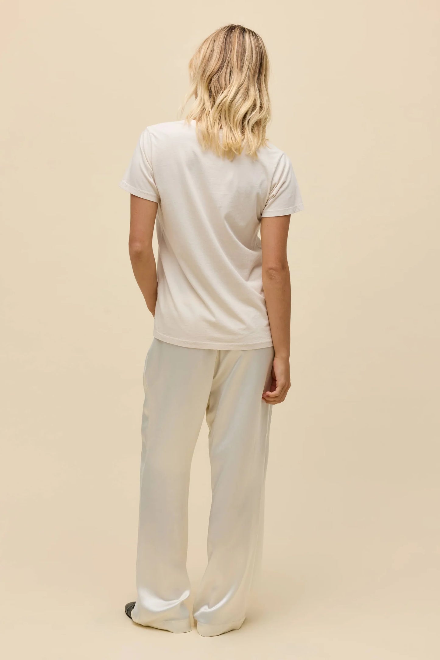 Dirty white graphic crewneck tee, back view with plain fabric