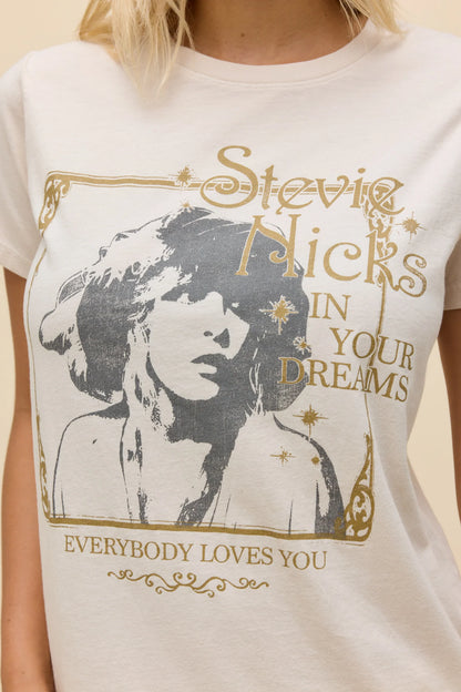Dirty white tee closeup with Stevie Nicks portrait graphic and gold slogan text