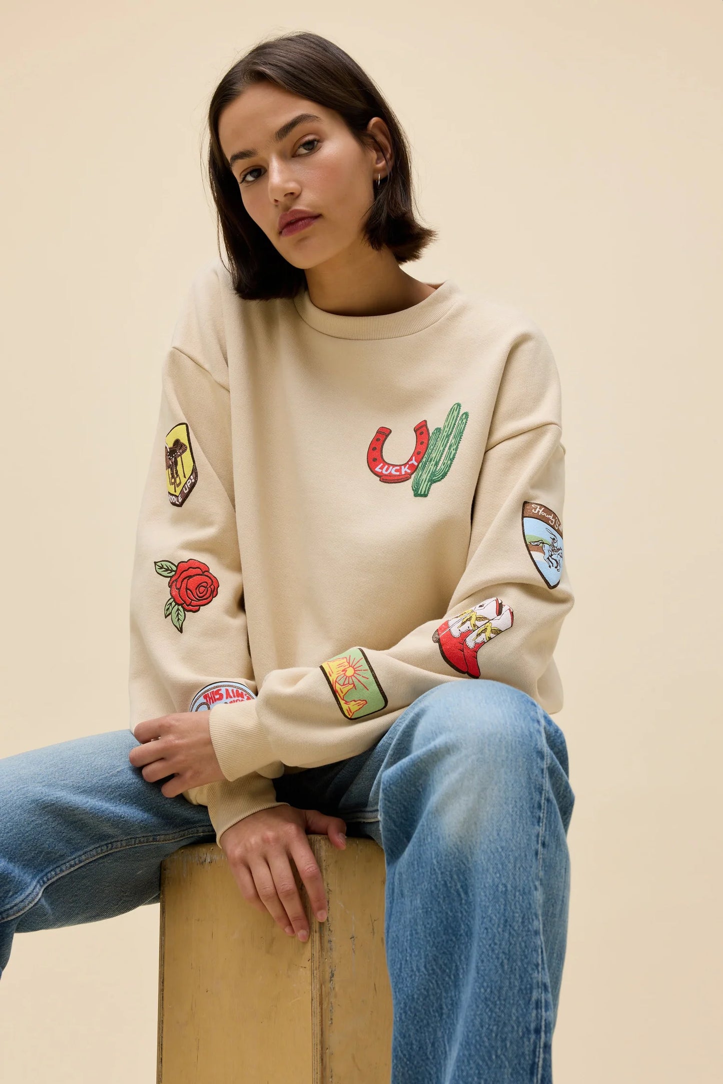 Sand oversized crew sweatshirt with colorful western patches on sleeves and chest