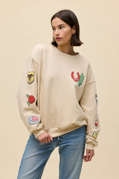 Sand oversized crew sweatshirt with western patches on sleeves and front graphic