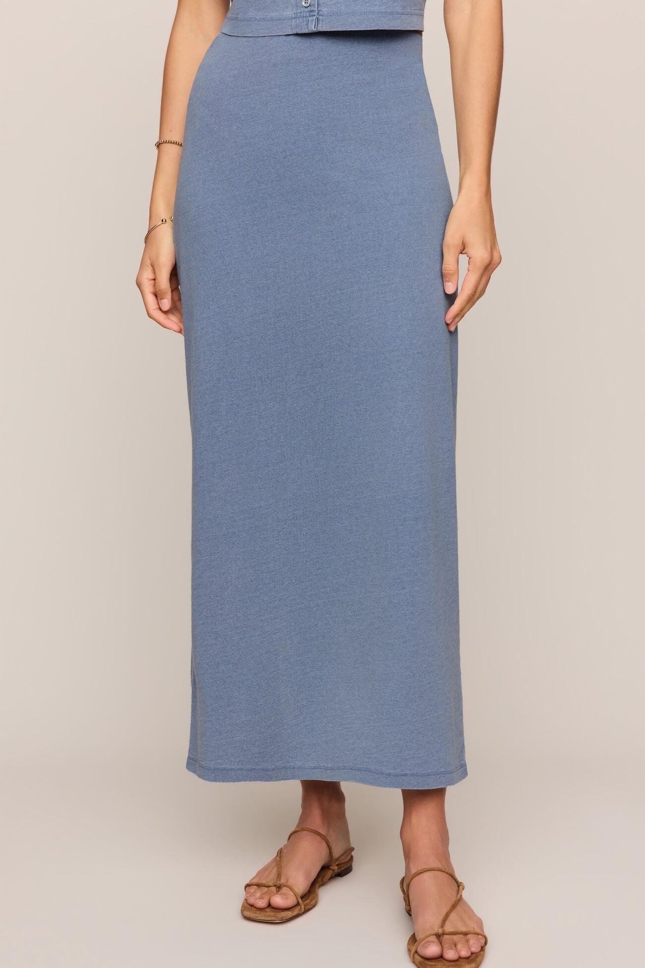 Indigo blue jersey denim midi skirt, front view with smooth straight fit.