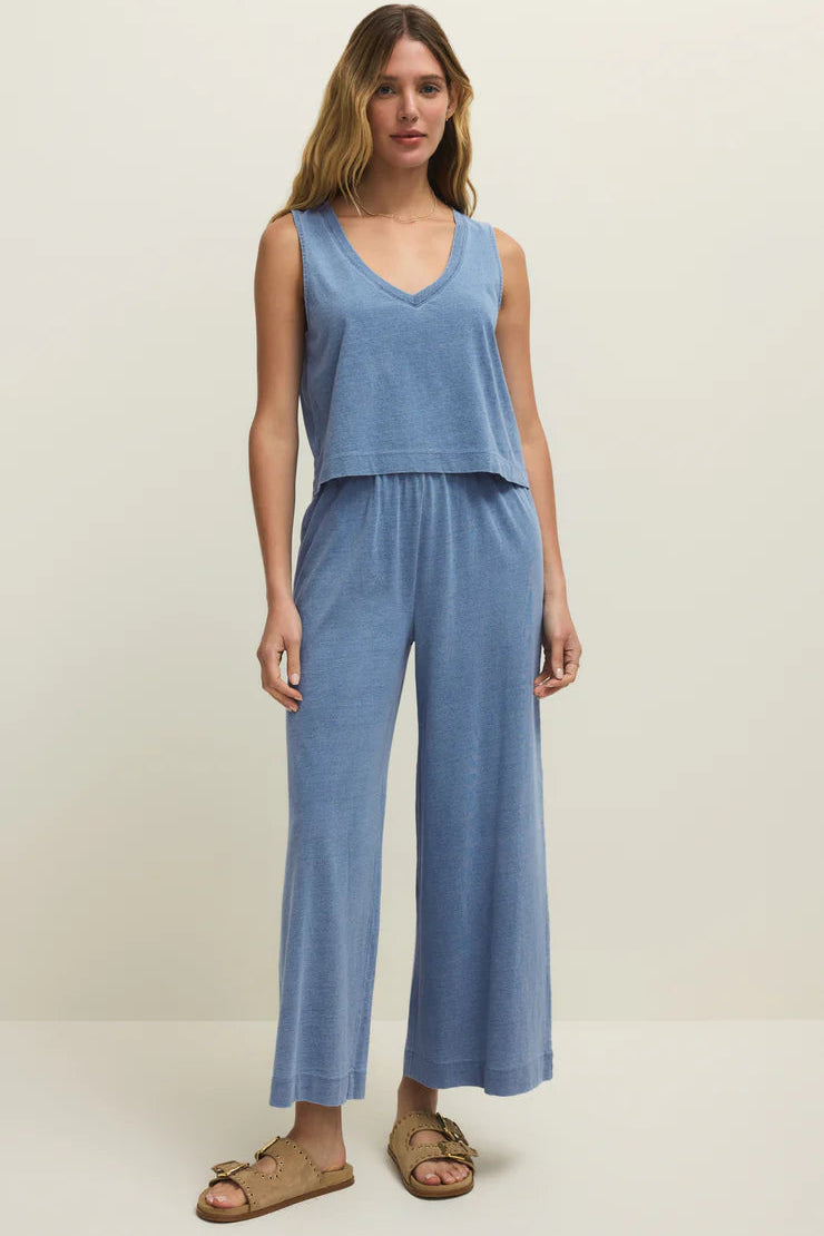 Blue denim V-neck tank with relaxed fit and curved hem
