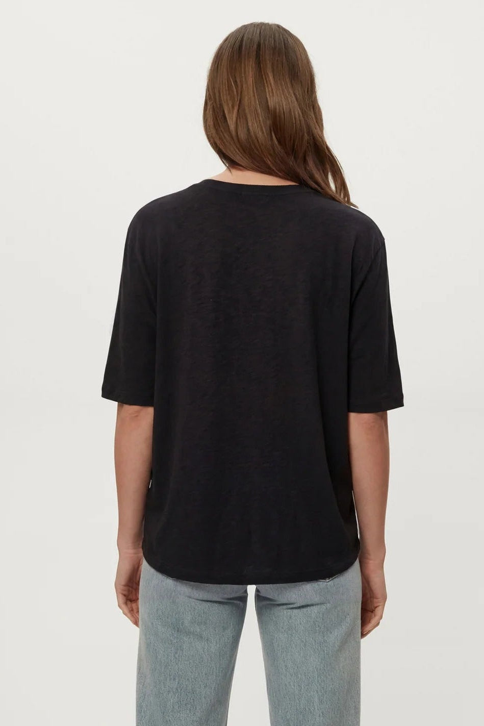 Black dolman tee, back view, loose drape with short sleeves
